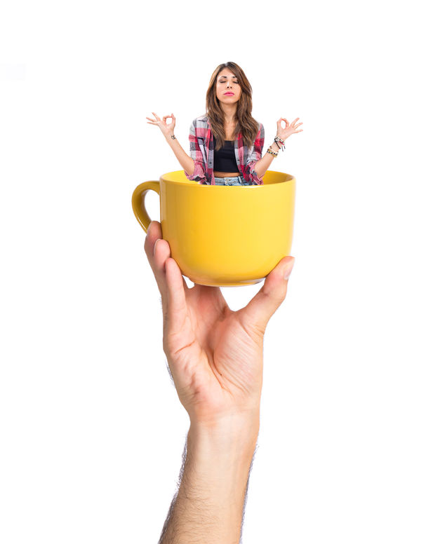 36121768 - pretty girl in zen position inside cup of coffee